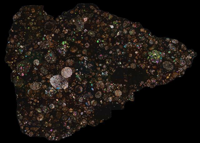 Thin Section of the Northwest Africa (NWA) 12692 Meteorite in cross polarized light.

Solar Anamnesis, CC BY-NC-ND 2.0 via Flickr: https://flic.kr/p/2m625Yu