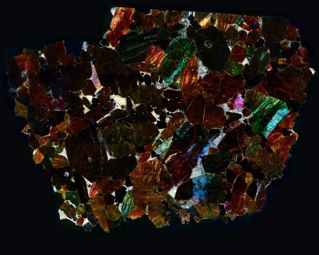 Thin Section of the Northwest Africa (NWA) 2737 Meteorite in cross polarized light.

Solar Anamnesis, CC BY-NC-ND 2.0 via Flickr: https://flic.kr/p/QtmFxC
