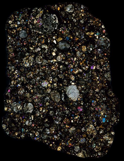 Thin Section of the Northwest Africa (NWA) 960 Meteorite in cross polarized light.

Solar Anamnesis, CC BY-NC-ND 2.0 via Flickr: https://flic.kr/p/XXq9WE