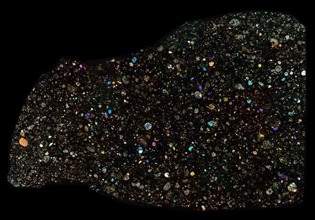 Thin Section of the Calama 005 Meteorite in cross polarized light.

Solar Anamnesis, CC BY-NC-ND 2.0 via Flickr: https://flic.kr/p/2dmPUTn