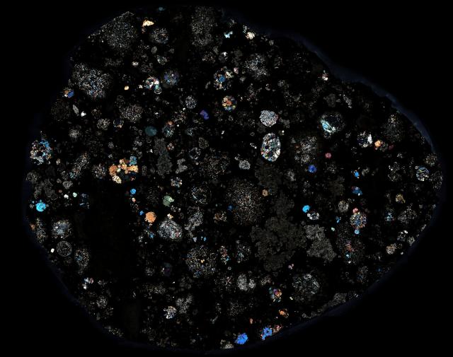 Thin Section of the Allende Meteorite in Cross Polarized Light.

Solar Anamnesis, CC BY-NC-ND 2.0 via Flickr: https://flic.kr/p/RfNNMu