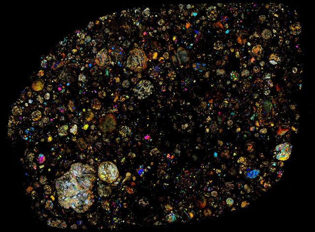 Thin Section of the Northwest Africa (NWA) 535 Meteorite in cross polarized light.

Solar Anamnesis, CC BY-NC-ND 2.0 via Flickr: https://flic.kr/p/N4shaR