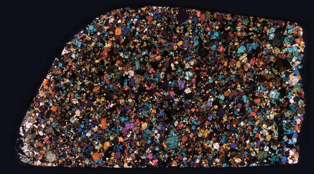 Thin Section of the Northwest Africa (NWA) 5384 Meteorite in cross polarized light.

Solar Anamnesis, CC BY-NC-ND 2.0 via Flickr: https://flic.kr/p/PuCywm