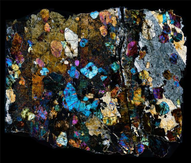 Thin Section of the Northwest Africa (NWA) 1950 Meteorite in cross polarized light.

Solar Anamnesis, CC BY-NC-ND 2.0 via Flickr: https://flic.kr/p/21HD4mv