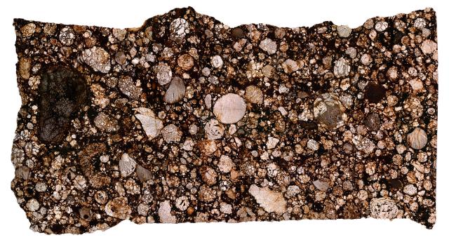 Thin Section of the Northwest Africa (NWA) 4216 Meteorite.

Solar Anamnesis, CC BY-NC-ND 2.0 via Flickr: https://flic.kr/p/2jW9ACx