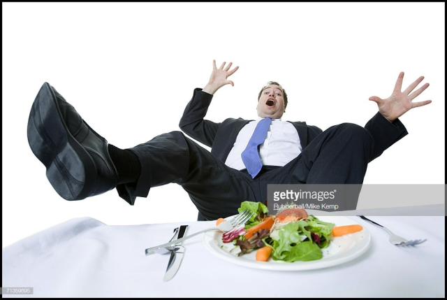 shocked man falling backwards off of chair
