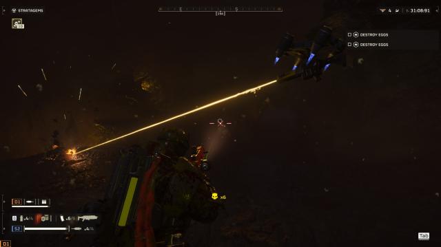 Helldivers 2 screenshot in the dark, showing a laser drone firing above my head