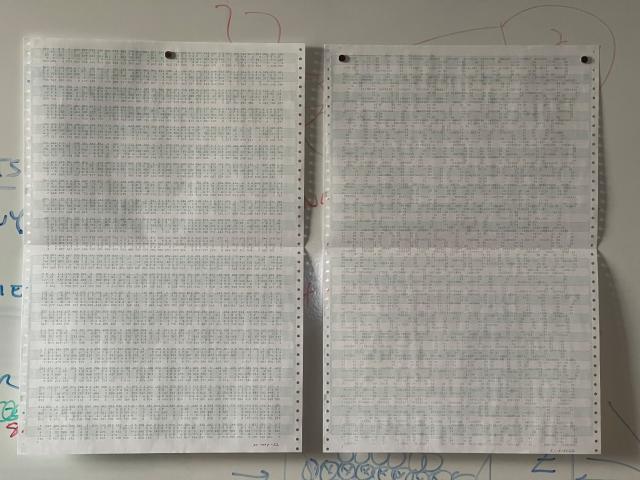 Two printouts of PI on greenbar paper made with a dot-matrix terminal. Each digit of pi is composed of smaller digits of pi.