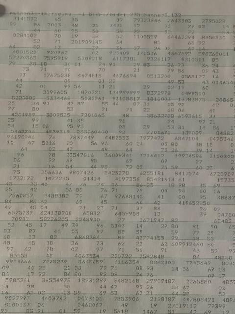 A closeup of one printout of PI. Each digit of pi is composed of smaller digits of pi.
