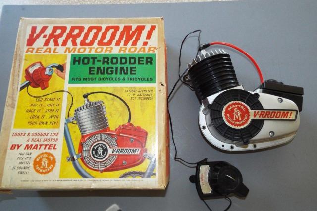 A Mattel V-RROOM! "real motor roar" toy engine to mount on your bicycle.