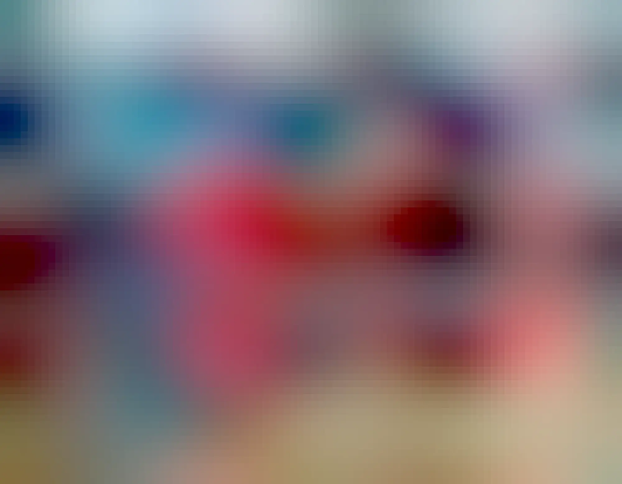 Two bookshelves painted in varied bright colours with intersecting shapes