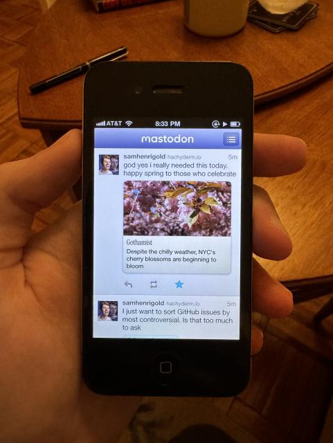 an iPhone 4 showing a period-correct Mastodon app interface