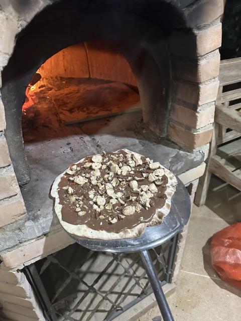 Desert pizza on the wood burning oven

Chocolate (brigadeiro) + sonho de valsa