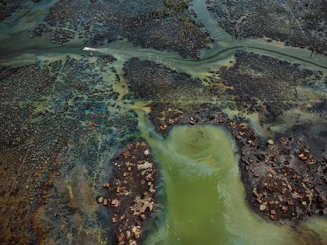 In Nigeria's oil-rich Niger Delta, oil bunkering — the practice of siphoning oil from pipelines — has transformed parts of the once-thriving delta ecosystem into an ecological dead zone, according to the U.N. Environment Programme.

Edward Burtynsky, courtesy Robert Koch Gallery, San Francisco / Nicholas Metivier Gallery, Toronto