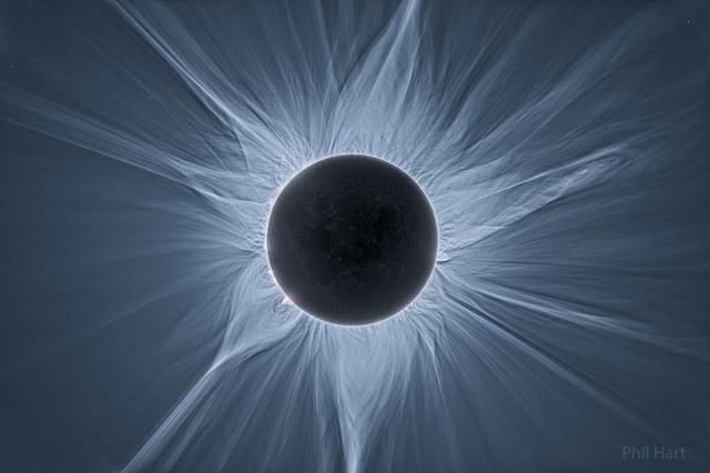 The Sun is shown during a total solar eclipse. Accentuated is the expansive corona of the Sun, which is shown streaming out in all directions.