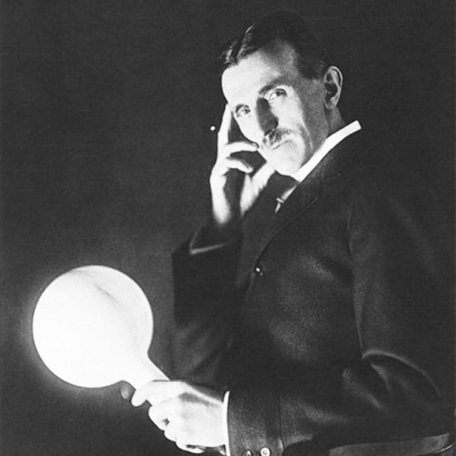 Nikola Tesla (sometime around 1898) holds a lightbulb several feet away from a generator, and it nevertheless continues to shine. The late 19th century was a time when light, power, messages, and voices could suddenly be summoned from the ether—there seemed no reason to think this fantastical progression should stop short of brainwaves and thoughts. Credit: Scewing / Wikimedia Commons