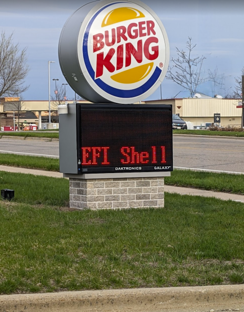 A Burger King sign with an electronic marquee that is displaying "EFI Shell"