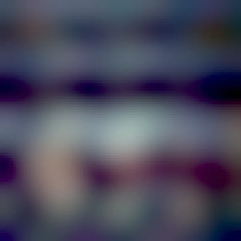 Photo of Dolly Parton in a white dress reading to a group of kids. Text  reads, "Some millionaires DIDN'T spend their dollars on space travel or a trip to the Titanic because they were writing checks to put 150 million books in the hands of children."