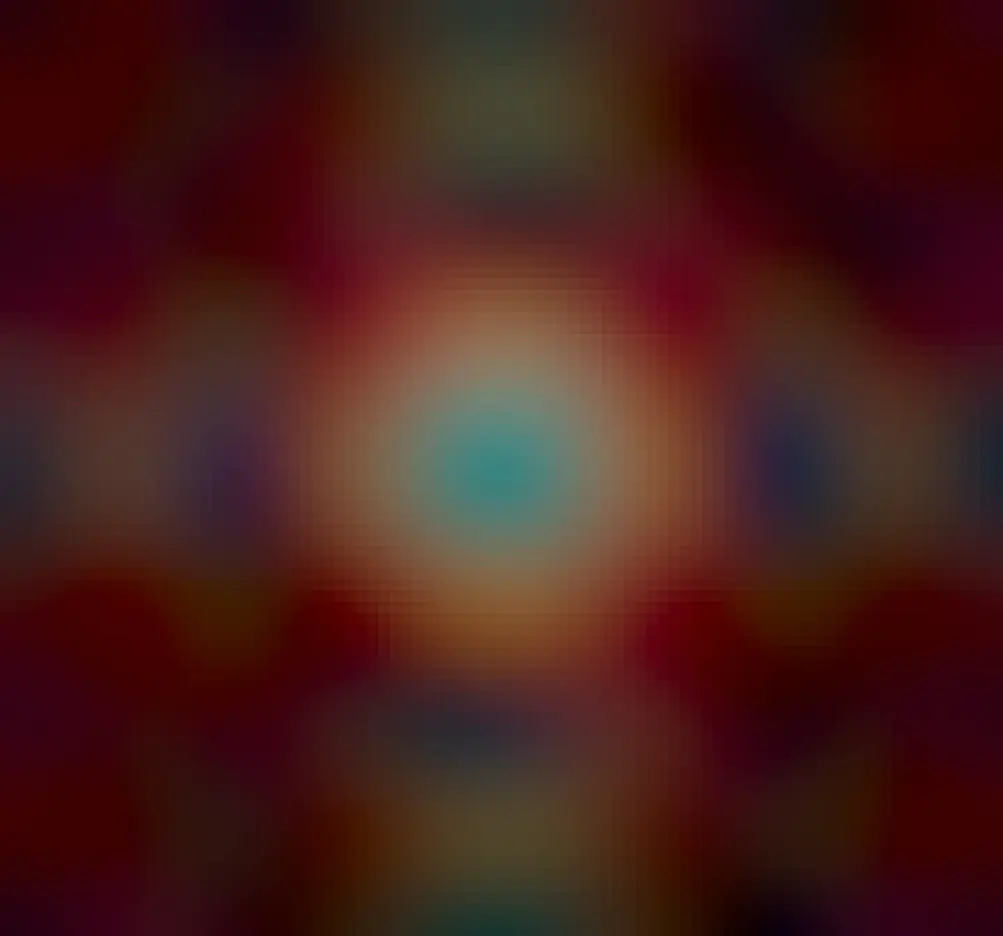 In the center is a colorful nebula, the most usually seen part of the Ring Nebula. Several layers of red-glowing gas with different structures are seen surrounding this center.