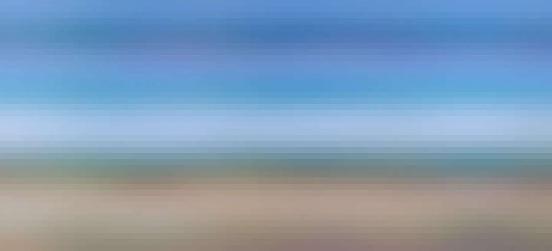 Sussex sea side, blue sky, emerald sea and pebble beach