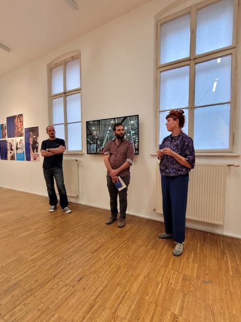AMRO Organizers teams standing in MERZ Galerie during the opening of the exhibition The project "Under the Calculative Gaze" by Sanela Jahić's.