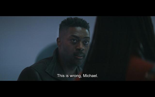 Book from Star Trek Discovery, facing Burnham who has turned towards him and away from the viewer, making direct eye contact with and looking very serious. He says, "This is wrong, Michael."