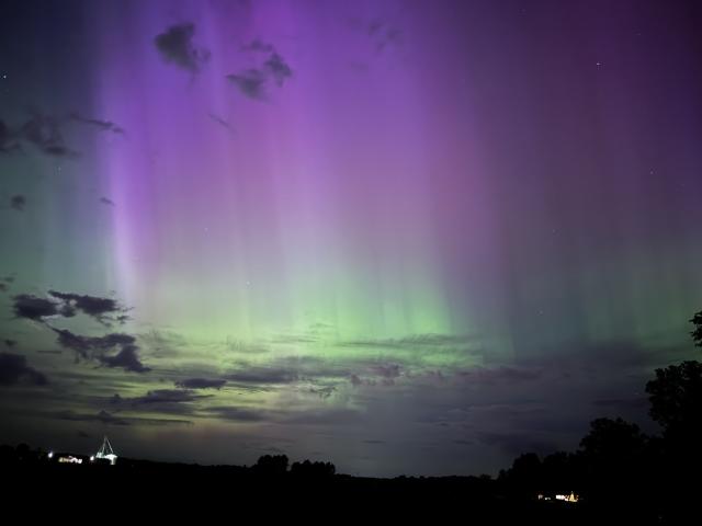 A pink and green night sky