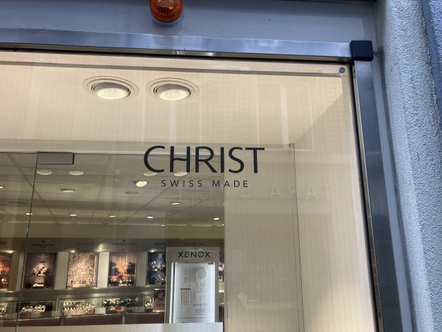A shop window with the text “Christ - Swiss made”