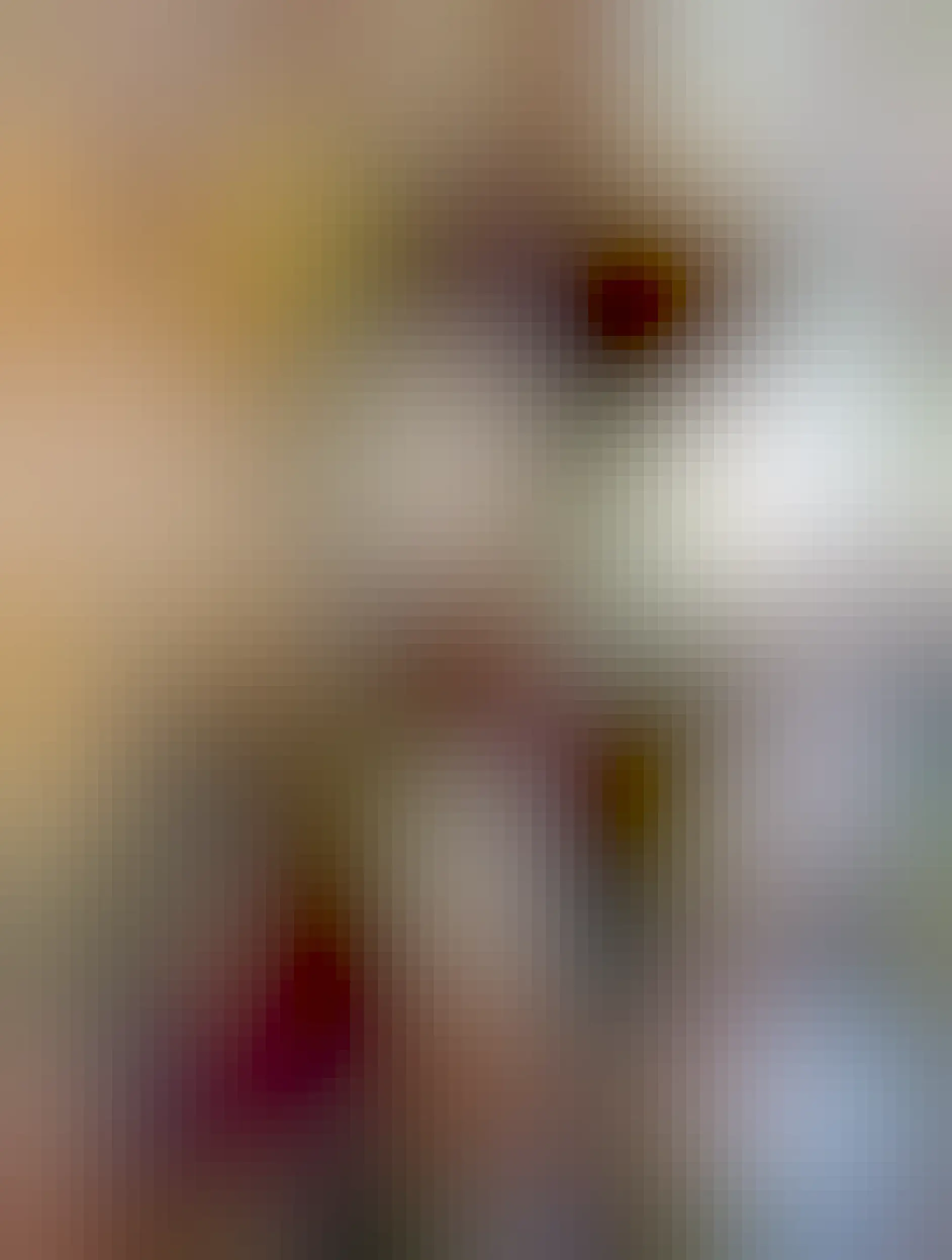 A large vertical cat tree with an orange tabby on the top, a blue tabby in the middle, and a calico on the lowest level in the shot. They all look pretty relaxed and cozy.