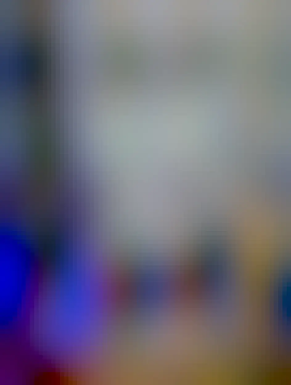 Picture of a tiny five port network switch with a Google WiFi node on top of it. Three cables are plugged in with their lights blinking.