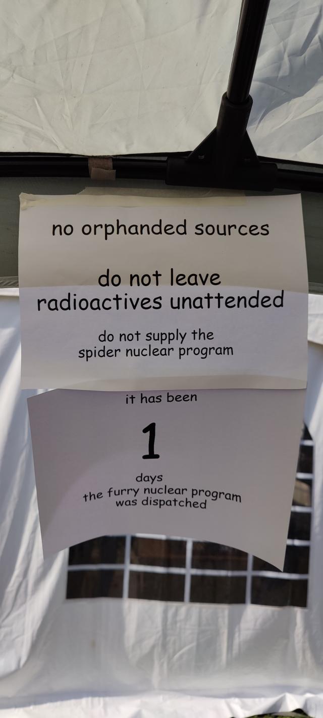 Sign in the swap shop that says "no orphaned sourced. do not leave radioactives unattended. do not supply the spider nuclear program. it has been 1 days since the furry nuclear program was dispatched"
