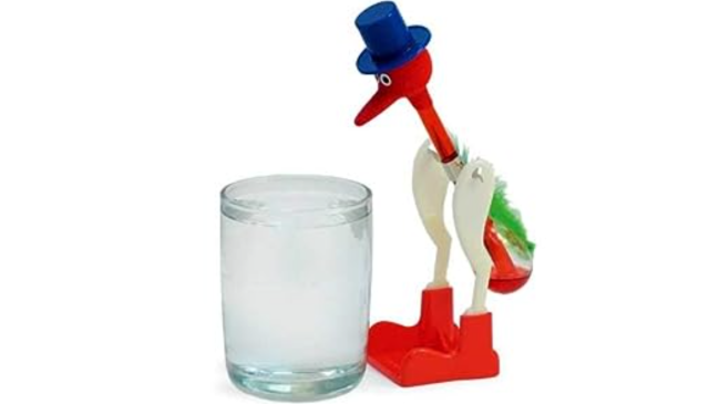 The famous Drinking Bird, a novelty toy which mimics the motions of a bird drinking from a water source using the same principle as a heat engine. In the Simpsons episode 'King-Size Homer', he uses the bird as a labor-saving device to continually press the 'Y' key on his home computer terminal.