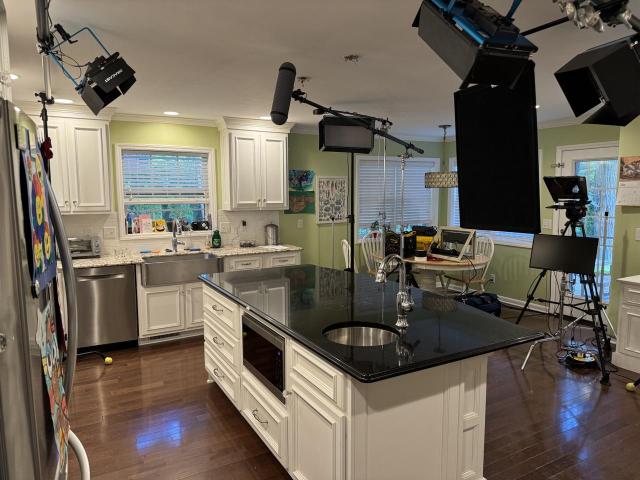 A kitchen full of filming equipment 