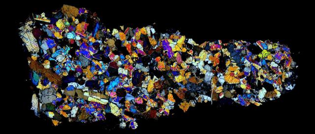 Thin Section of the Northwest Africa (NWA) 998 Meteorite in cross polarized light.

Solar Anamnesis, CC BY-NC-ND 2.0 via Flickr: https://flic.kr/p/NTPe1H