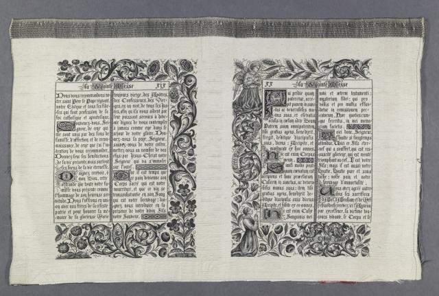 A photo of a double page spread of a woven book made in Lyon, France in the late 1800s.