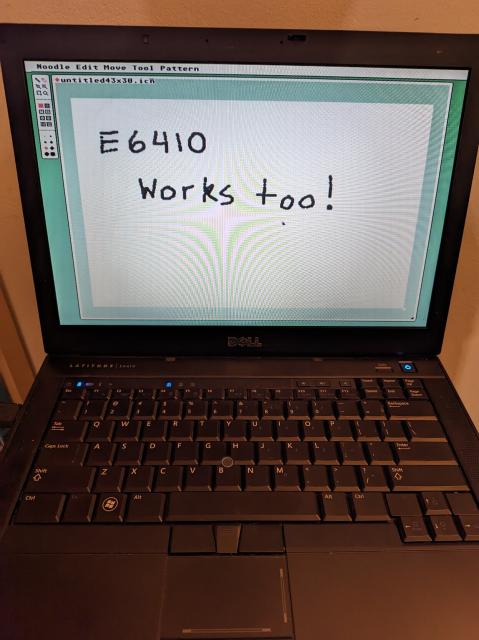 An old Dell laptop showing the uxn program Noodle with "E6410 Works too!" written on the canvas