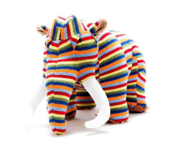 Photograph of a gorgeous Woolly Mammoth wearing colourful stripes