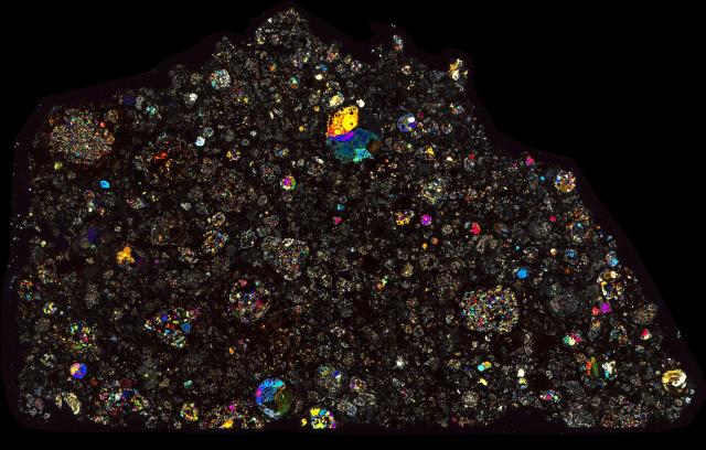 Dar al Gani (DaG) 1040 Meteorite Thin Section - XPL HDR Pathscan Enabler.

Solar Anamnesis, CC BY-NC-SA 2.0 via Flickr: https://flic.kr/p/2hyF1yf