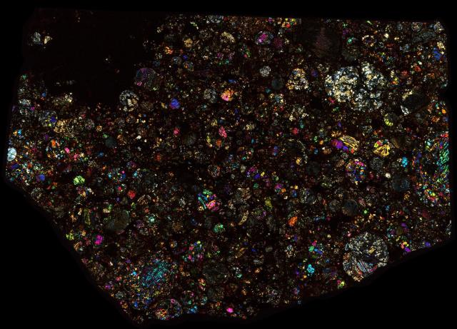 Talbachat n'aït Isfoul Meteorite Thin Section - XPL HDR Pathscan Enabler.

Solar Anamnesis, CC BY-NC-SA 2.0 via Flickr: https://flic.kr/p/2hnbzrx