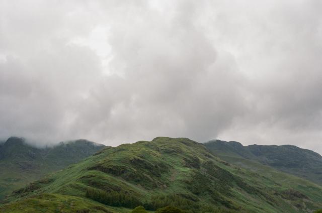 Green fell scraping the clouds.