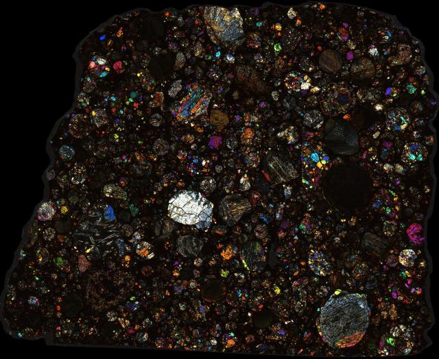 Northwest Africa (NWA) 2097 Meteorite Thin Section - XPL HDR Pathscan Enabler.

Solar Anamnesis, CC BY-NC-SA 2.0 via Flickr: https://flic.kr/p/2hiNJ63