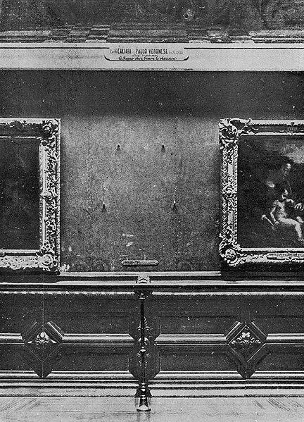 The Mona Lisa's vacant place in the Salon Carré, Louvre Museum, after having been stolen in 1911. Above the vacant wall space is Veronese's The Feast at the House of Simon (now in the Museum of Château de Versailles), on one side, Titian's Allegory painted for Alfonso d'Avalos, and on the other Correggio's 'Betrothal of St. Catharine [Catherine] of Alexandria'.