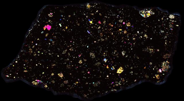 Murchison Meteorite Thin Section - XPL HDR Pathscan Enabler.

Solar Anamnesis, CC BY-NC-SA 2.0 via Flickr: https://flic.kr/p/2hwbc4n