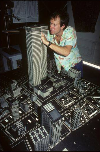 Model twin towers having reflective tape applied by a special effects technician
