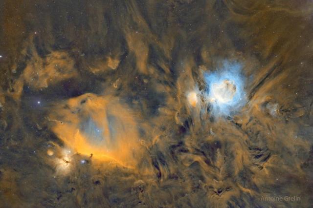 The featured image a starfield that glows gold. On the left is the dark horsehead nebula, while on the right is the blue-glowing Orion Nebula.