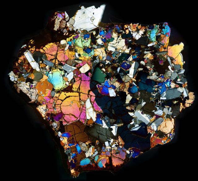 Thin Section of the Northwest Africa (NWA) 10646 Meteorite in Cross Polarized Light.

Solar Anamnesis, CC BY-NC-ND 2.0 via Flickr: https://flic.kr/p/SwPZVu