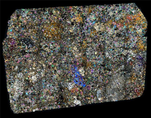 Thin Section of the Northwest Africa (NWA) 10690 Meteorite in Cross Polarized Light.

Solar Anamnesis, CC BY-NC-ND 2.0 via Flickr: https://flic.kr/p/21Ct6iJ