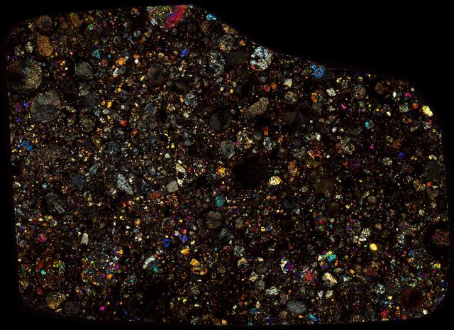 Northwest Africa (NWA) 8121 Meteorite Thin Section - XPL HDR Pathscan Enabler.

Solar Anamnesis, CC BY-NC-SA 2.0 via Flickr: https://flic.kr/p/2iaCf6T