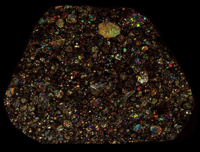 Northwest Africa (NWA) 2377 Meteorite Thin Section - XPL HDR Pathscan Enabler.

Solar Anamnesis, CC BY-NC-SA 2.0 via Flickr: https://flic.kr/p/2hNeneL