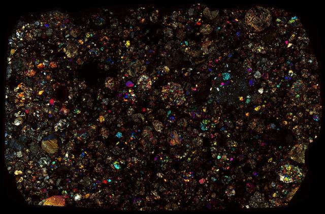 Northwest Africa (NWA) 4560 Meteorite Thin Section - XPL HDR Pathscan Enabler.

Solar Anamnesis, CC BY-NC-SA 2.0 via Flickr: https://flic.kr/p/2hV75uf